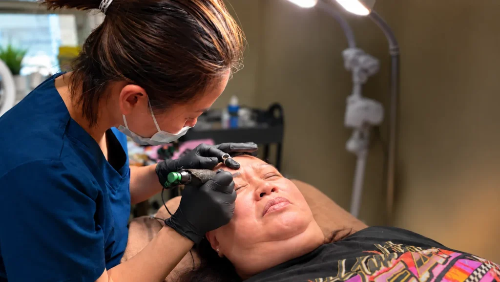 Permanent makeup artist applying Nano Brows at Vivi Brows & Head Spa in London, Ontario